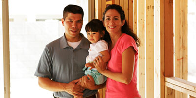 family in home under construction